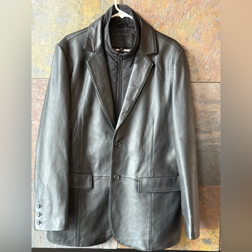 Black leather sport coat with zipper inner warmer on front. Is removable, 42R,